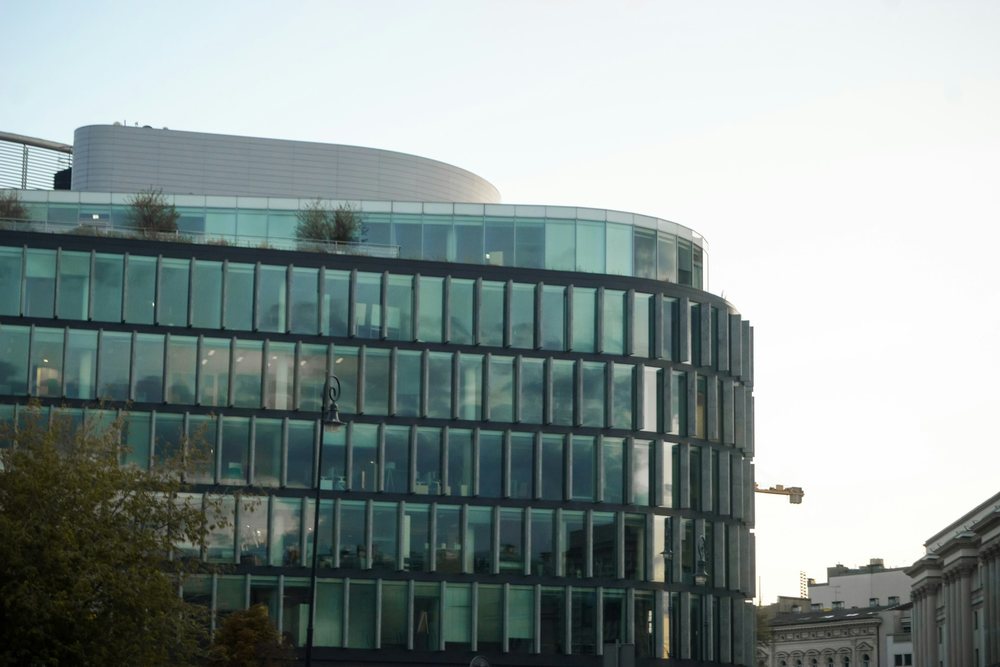 Modern glass office building with a curved corner